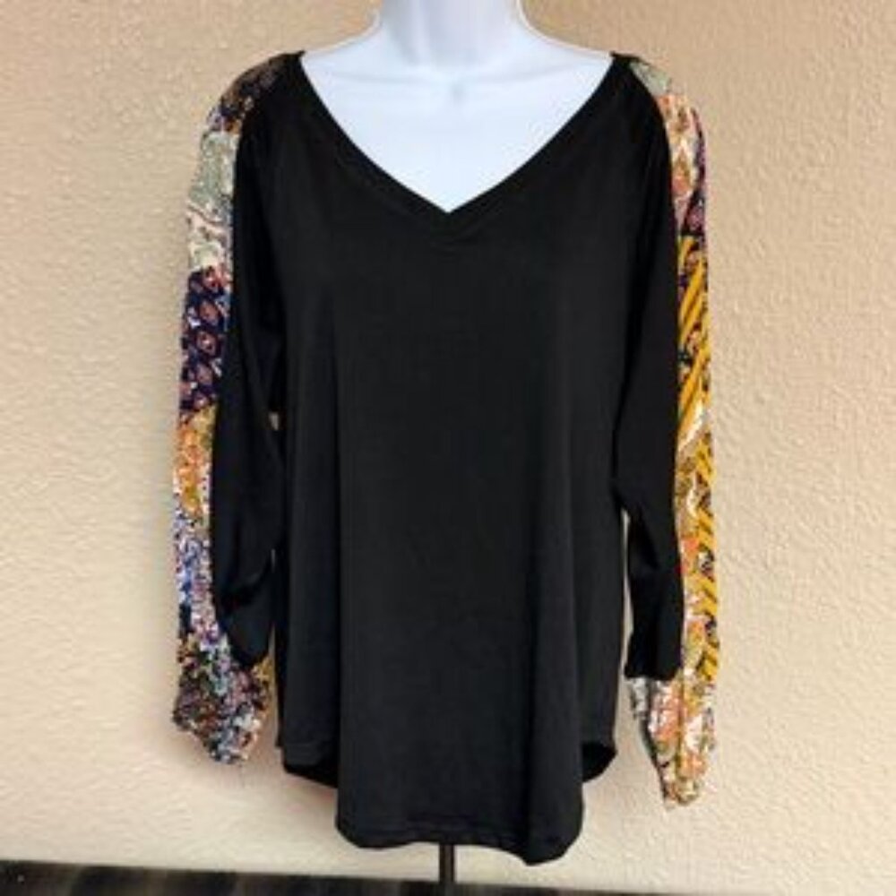 Boho black top with colorful patchwork sleeves. NWT.